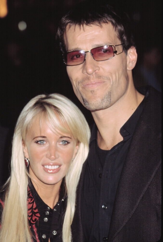 Tony Robbins with his wife at the Red Dragon premiere, 8x10 poster print.