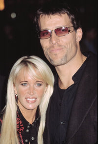 Tony Robbins with his wife at the Red Dragon premiere, 8x10 poster print.
