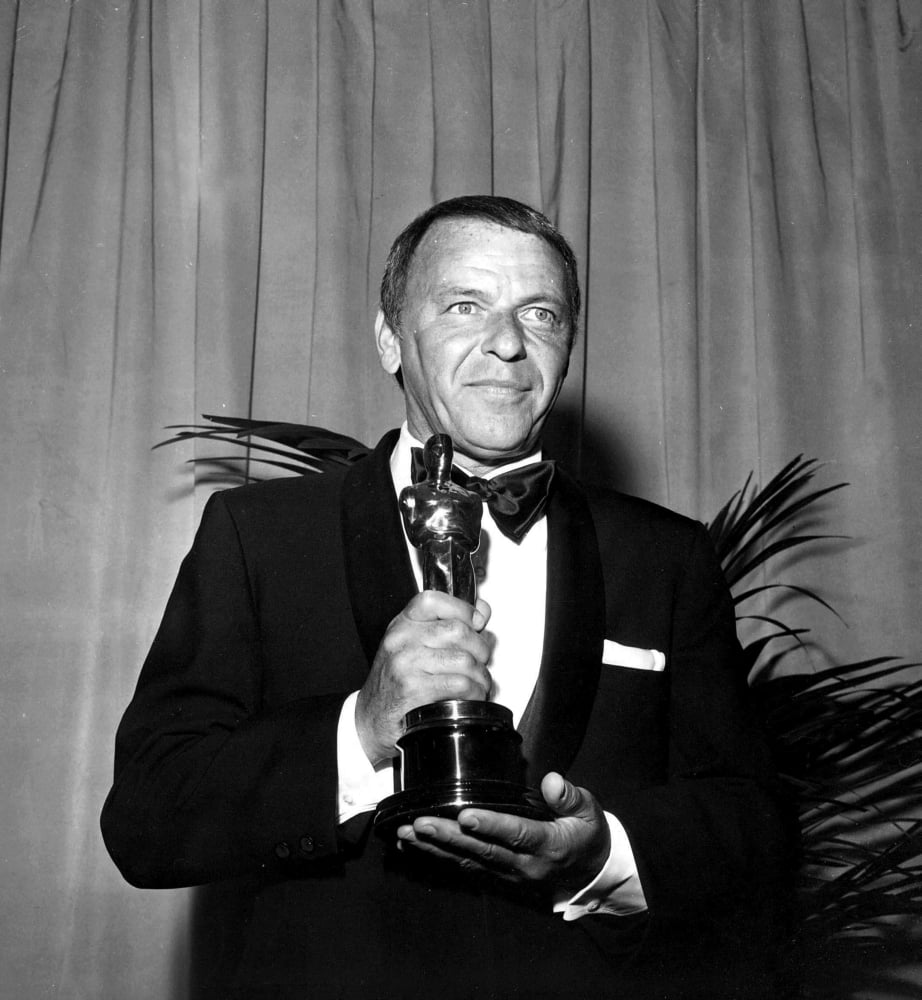 Frank Sinatra holding an Oscar trophy photo print