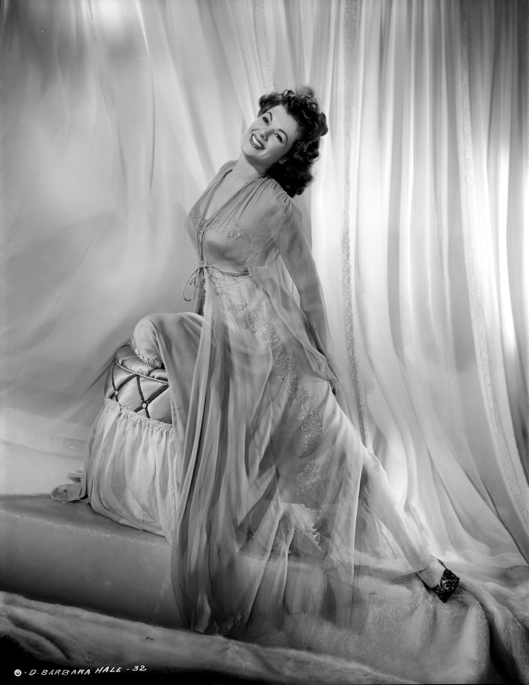 Barbara Hale vintage photo print in see-through dress sitting on a chair