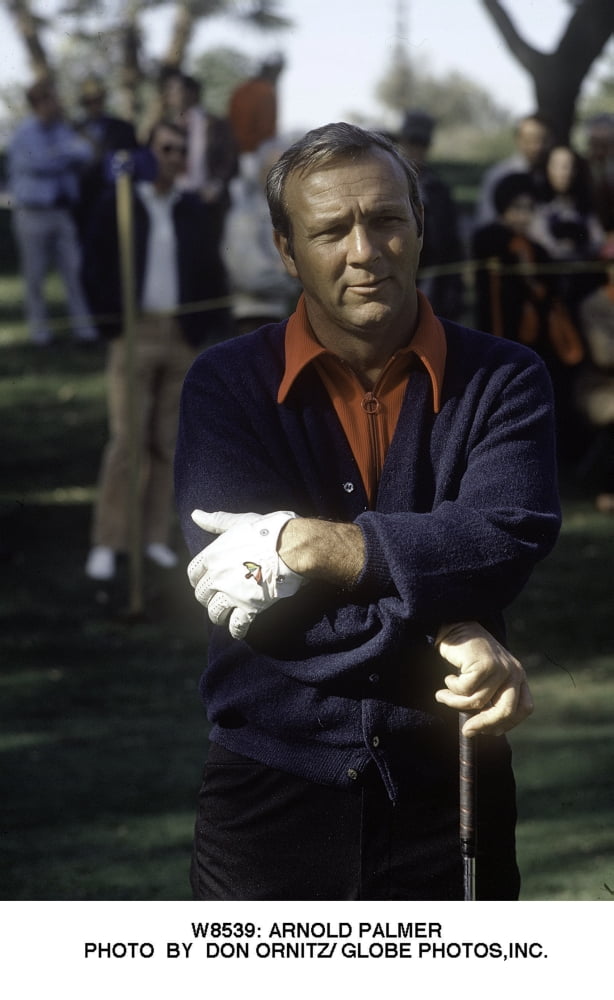Arnold Palmer playing golf photo print showcasing a legendary sports moment.