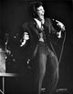 Tom Jones singing photo print, capturing the energy of a music legend.