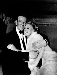 Photo print of Fred Astaire and Ginger Rogers embracing, classic Hollywood moment.