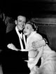 Photo print of Fred Astaire and Ginger Rogers embracing, classic Hollywood moment.