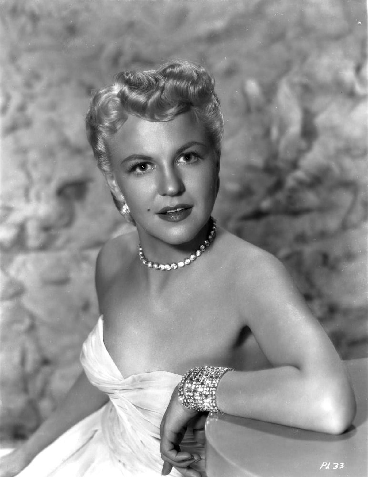 Peggy Lee seated in white gown with pearl necklace portrait photo print