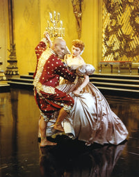 Yul Brynner dancing with a lady in shiny dress photo print.