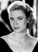 Grace Kelly photo print featuring black top, pearl necklace, and earrings.
