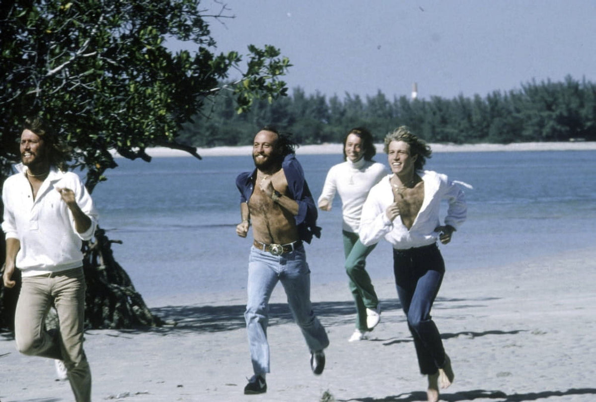 Bee Gees running on the beach photo print in vibrant colors.