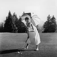 Audrey Hepburn golf photo print showcasing elegance and charm.