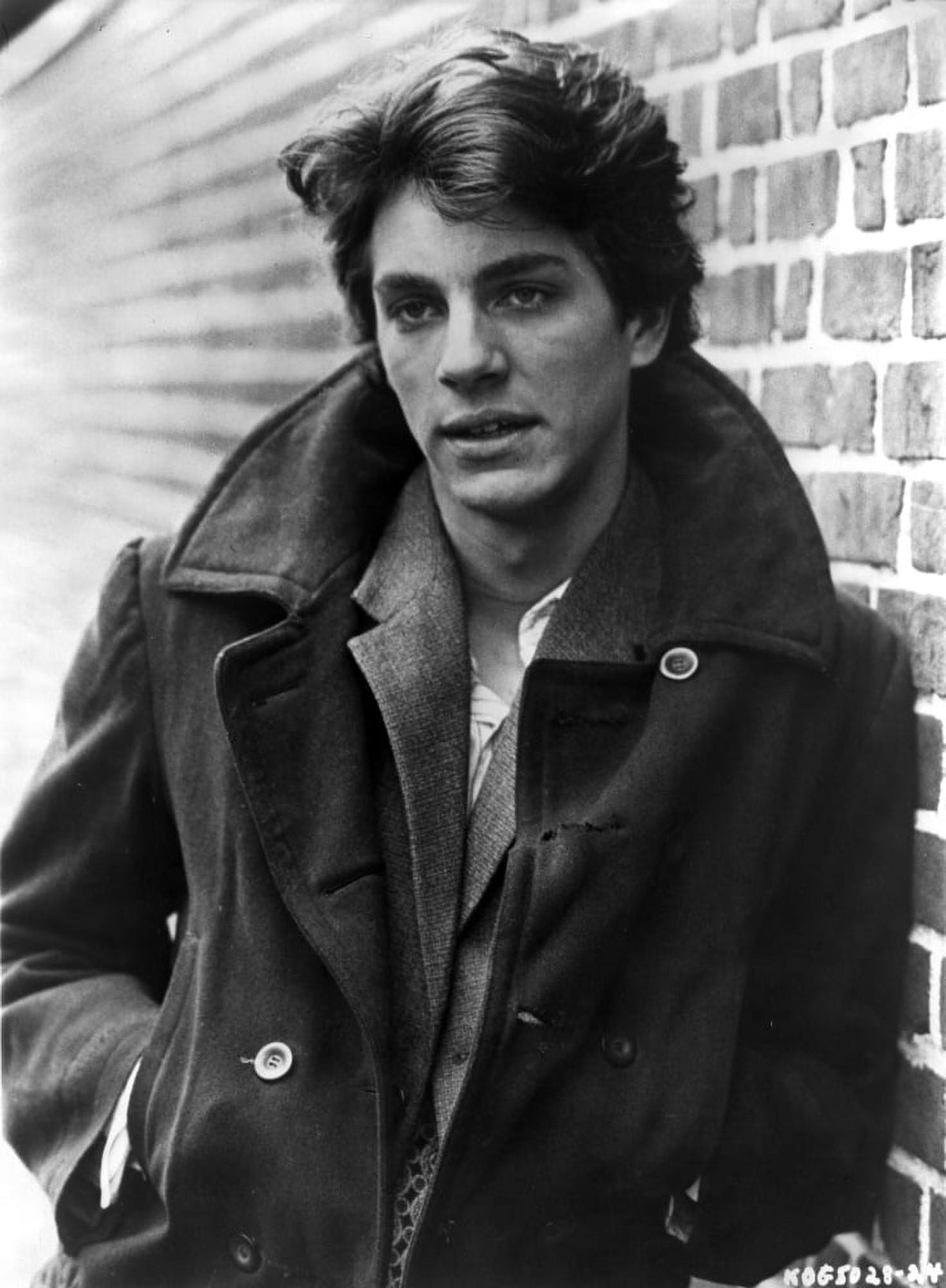Eric Roberts stylish photo print in front of a brick wall.