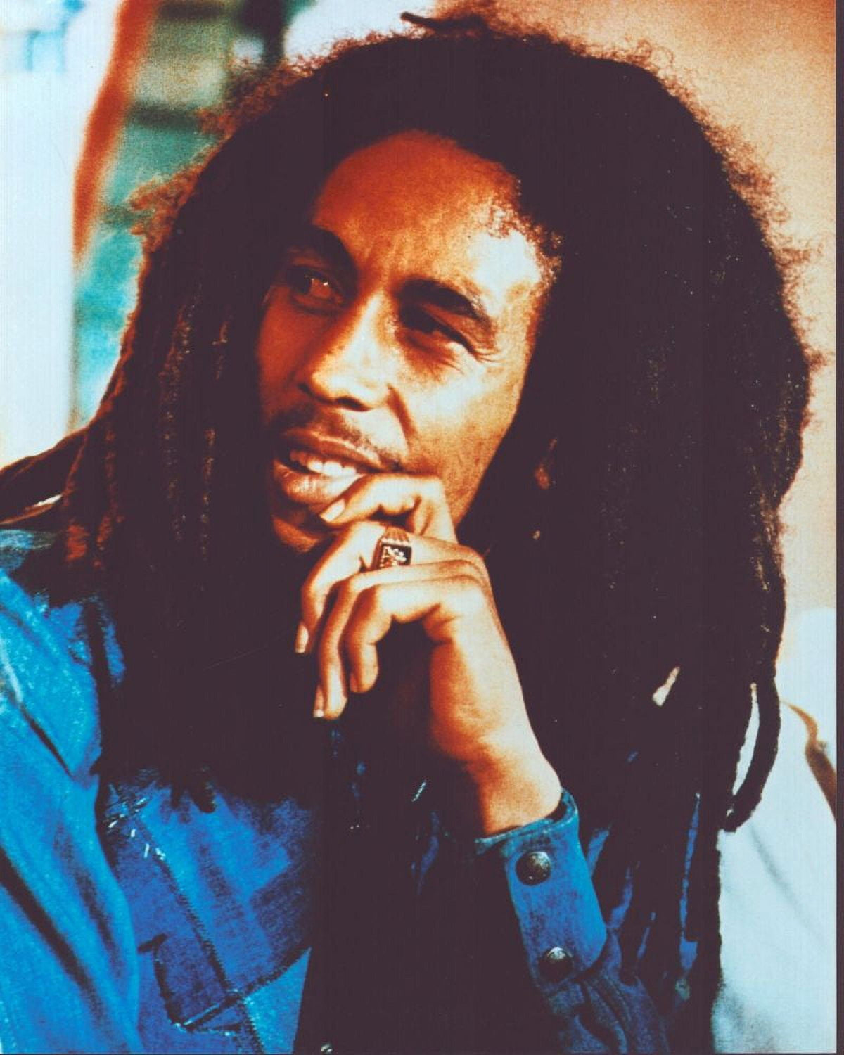 Bob Marley photo print in blue shirt, reggae music icon.
