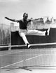 Fred Astaire leaping over a tennis net - Black and White Photo Print