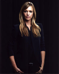 A.J. Cook photo print in black blazer against a black background