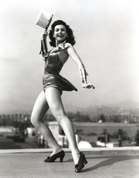 Classic portrait photo print of Ann Miller dancing on the rooftop, available in multiple sizes.