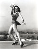 Classic portrait photo print of Ann Miller dancing on the rooftop, available in multiple sizes.