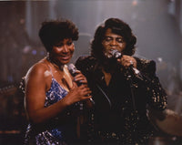 Candid photo print of Aretha Franklin in a glitter dress during a duet.