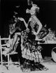 Marlene Dietrich standing on one leg in floral gown photo print