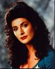 Marina Sirtis headshot photo print in blue top with gray background