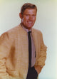 Chuck Connors posed in a brown coat photo print.