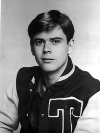 Photo print of Thomas Howell wearing a varsity jacket.