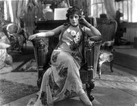 Theda Bara vintage photo print showcasing a stylish dress and seated pose.