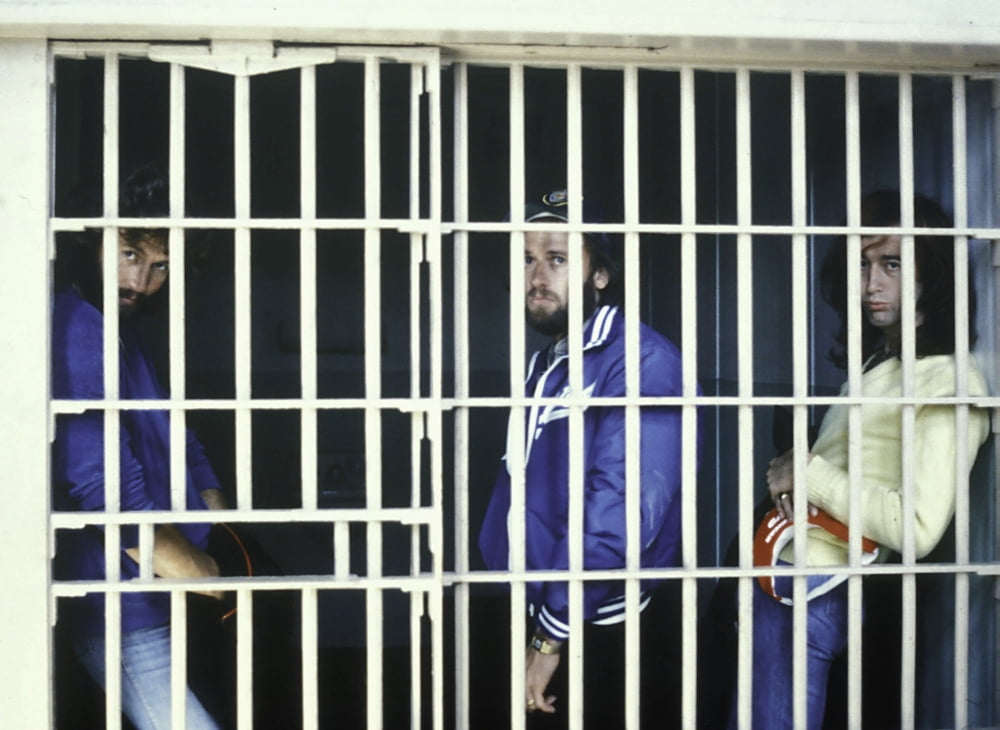 The Bee Gees iconic photo print featuring the band in a prison cell.