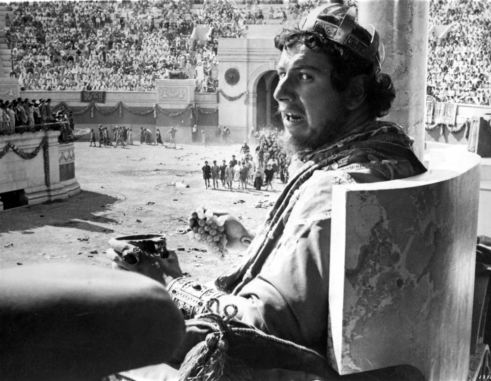 Photo print of Peter Ustinov watching a gladiator game, available in multiple sizes.