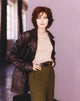 Madchen Amick standing in black coat photo print
