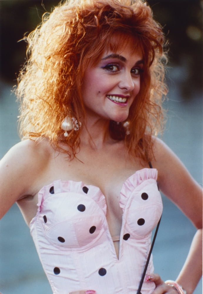 Julie Brown posed wearing a pink mini skirt photo print.