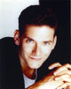 Campbell Scott stylish portrait photo print in black suit and gray shirt.