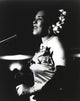 Billie Holiday in gown singing photo print capturing her timeless elegance.