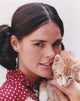 Ali MacGraw posed in red dress with kitten photo print
