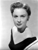 Joan Leslie elegant portrait photo print in black v-neck dress.